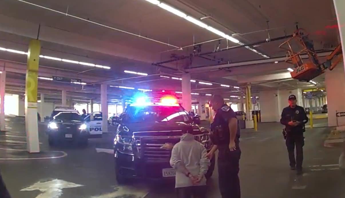 Torrance Police detaining someone in a parking garage